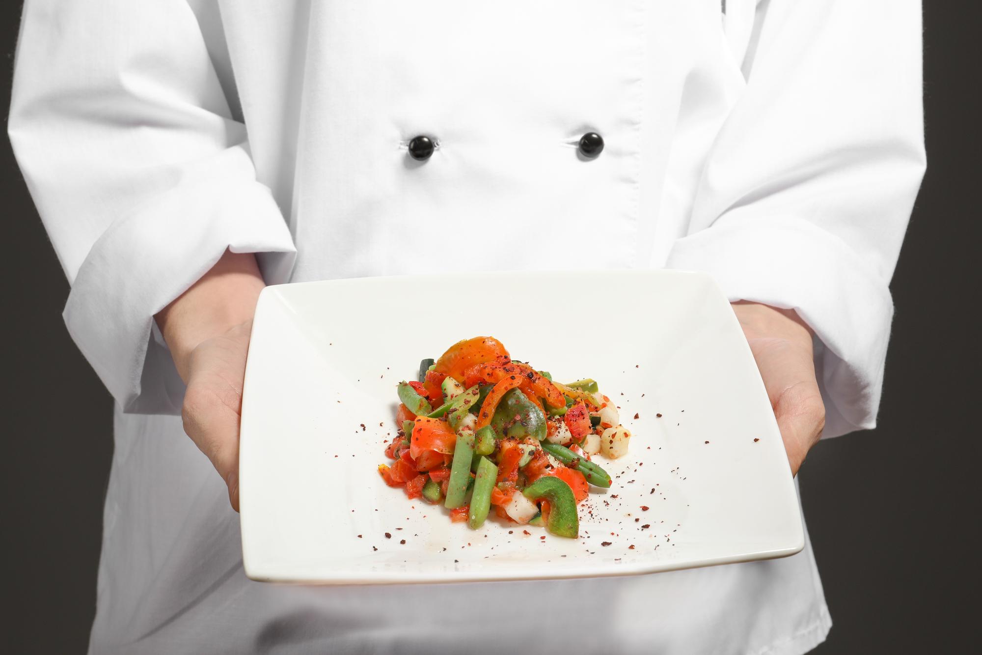 Chef plating a modern dish